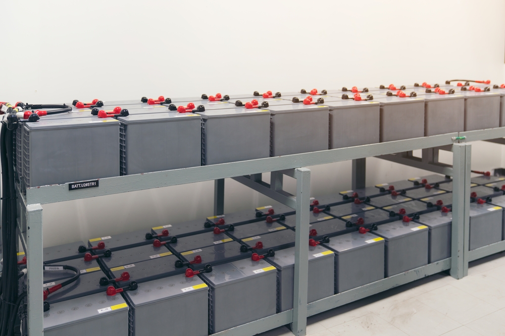rows-of-battery-packs-supply-stacked-in-a-room